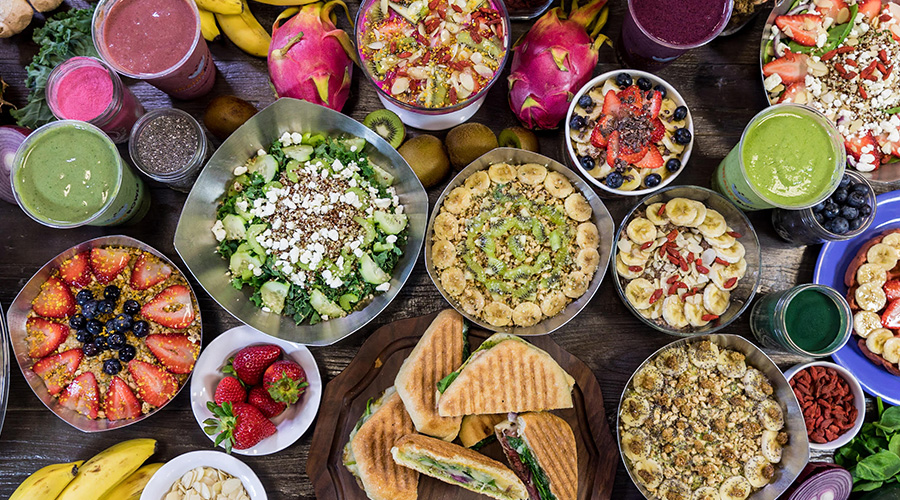 A table full of Vitality Bowls' delicious menu items.